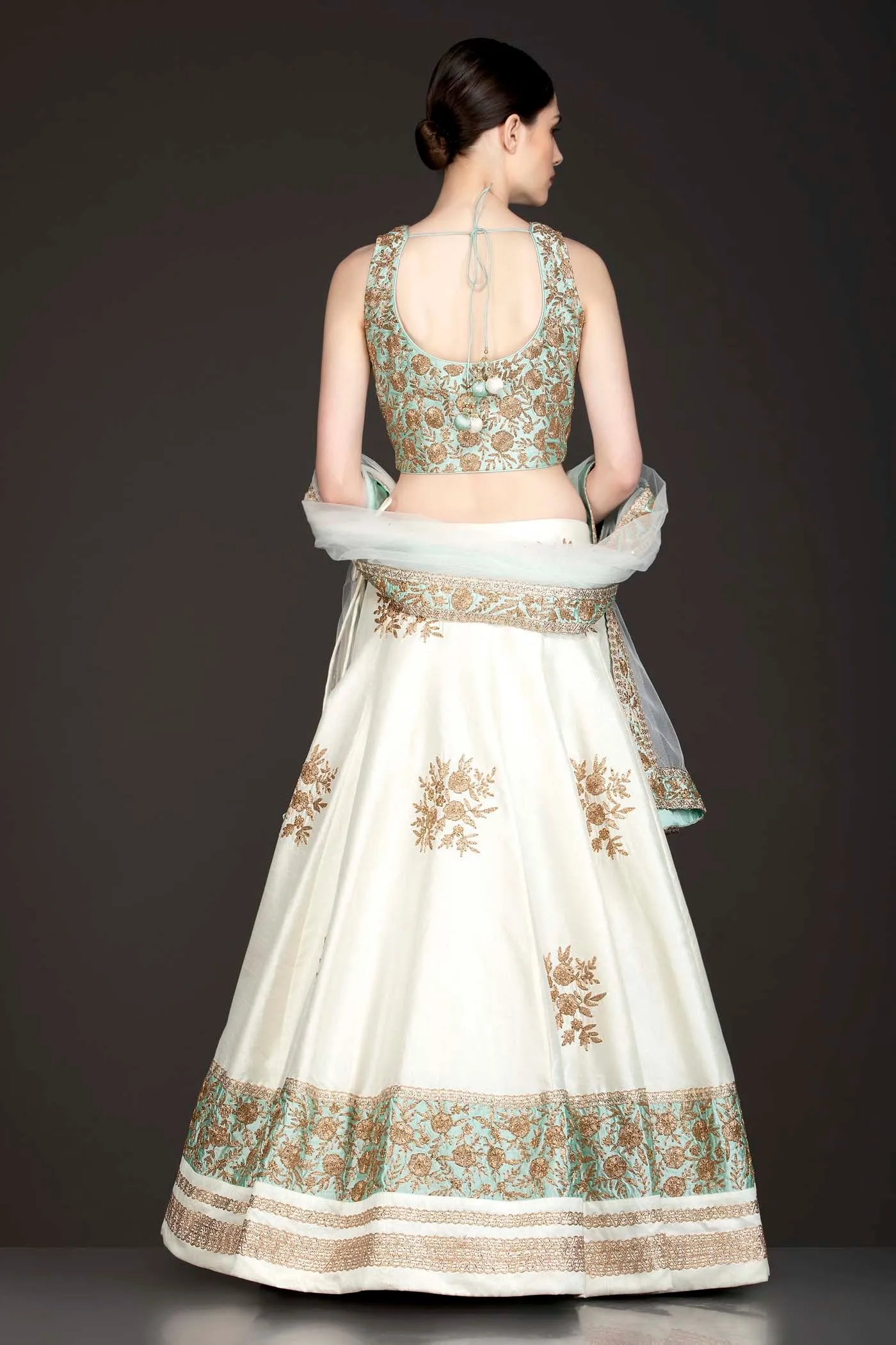 Mint Green Silk Top With Ivory Silk Lehenga With Net Dupatta