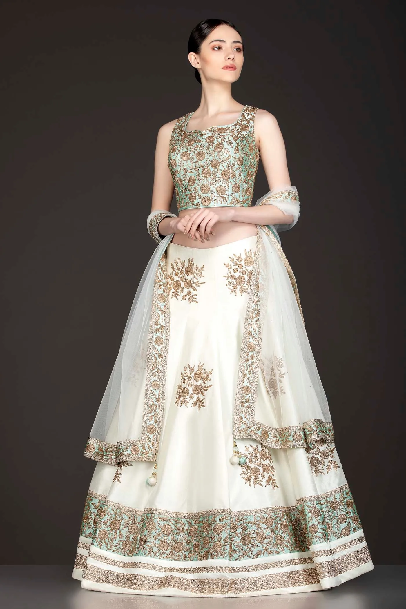 Mint Green Silk Top With Ivory Silk Lehenga With Net Dupatta